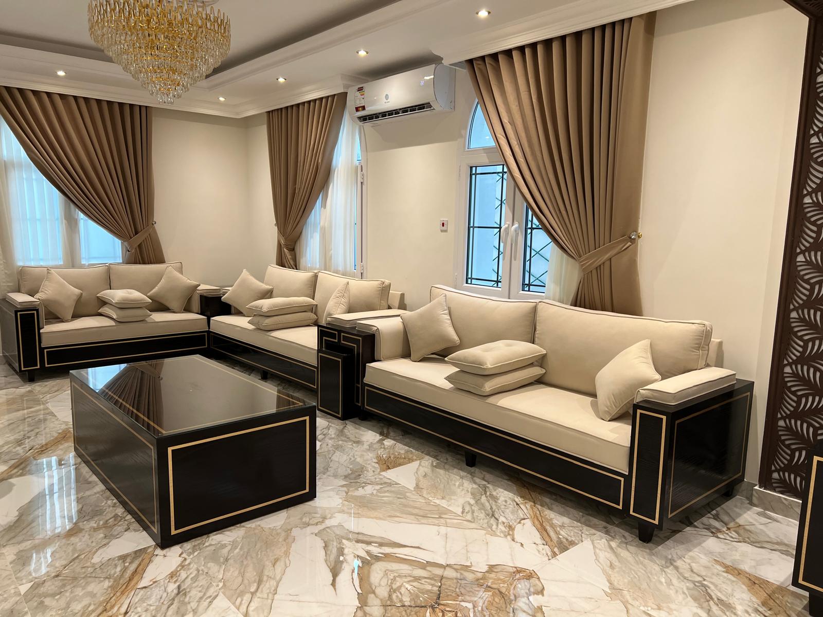 Modern majlis seating with low backs in a contemporary Doha villa (view 2)